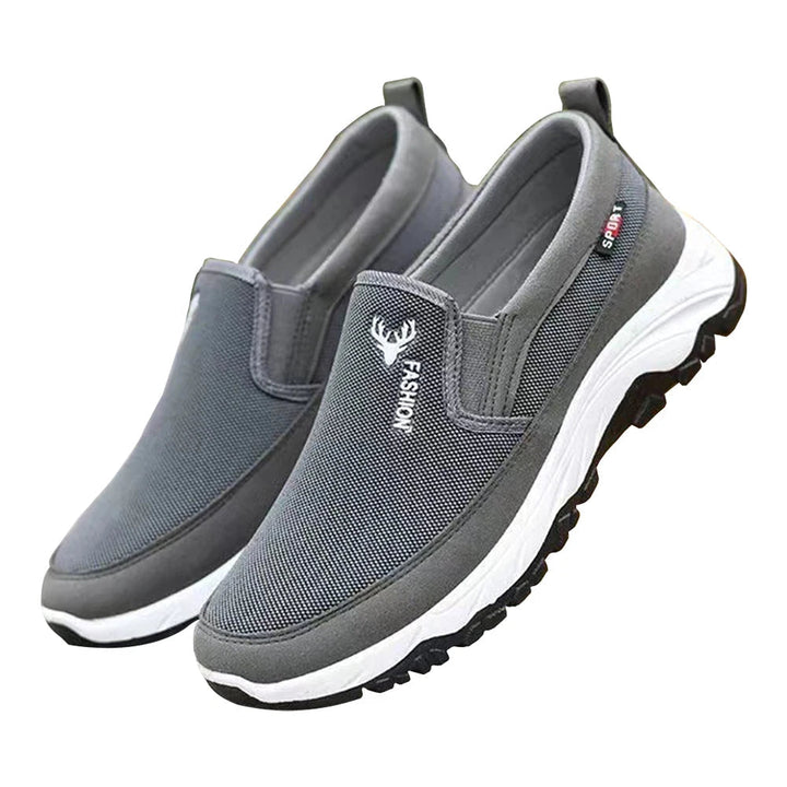 Men's cushioned slip-on walking shoes with breathable mesh, elastic panels, and grip outsole for comfort and stability.