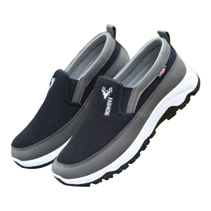 Men's cushioned slip-on walking shoes with breathable mesh, elastic panels, and grip outsole for comfort and stability.
