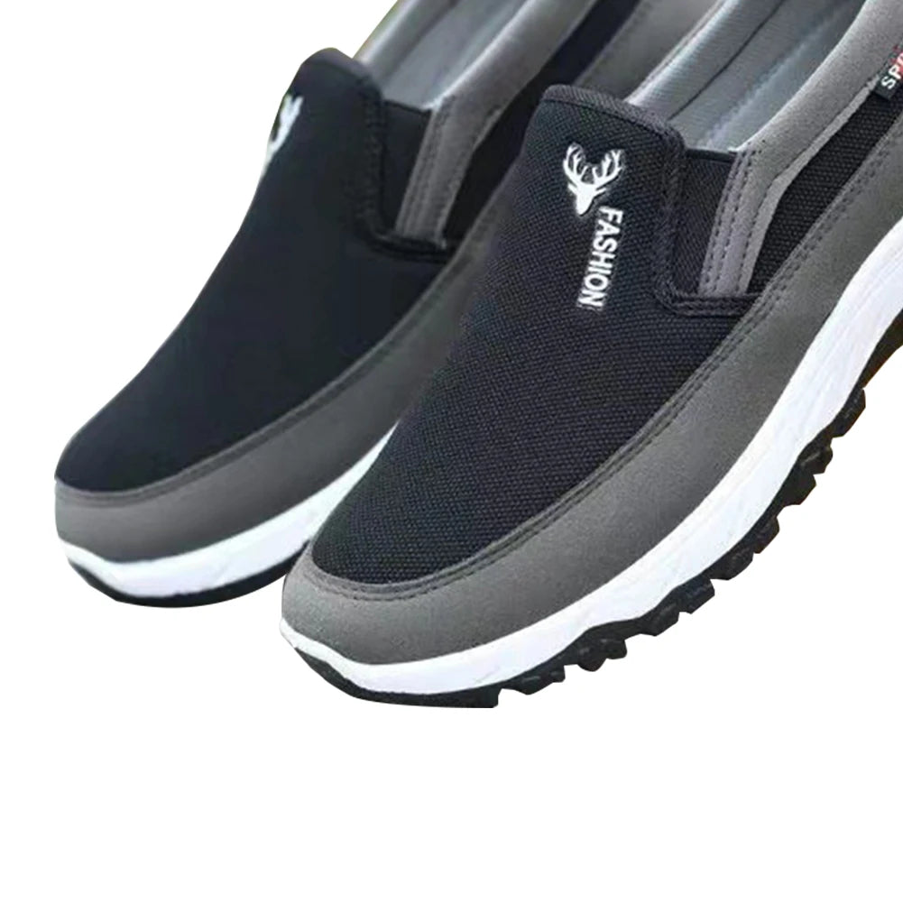 Men's cushioned slip-on walking shoes with breathable mesh, elastic panels, and grip outsole for comfort and stability.