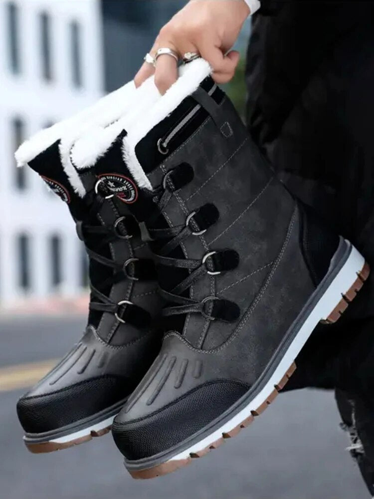 "Men's waterproof brown mid-calf snow boots with orthopedic support, lace-up, insulated for warmth, durable design."