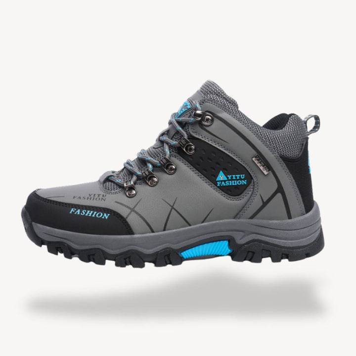 Men's waterproof orthopedic hiking boots with rugged outsole, showcasing durable design and secure lace-up closure.