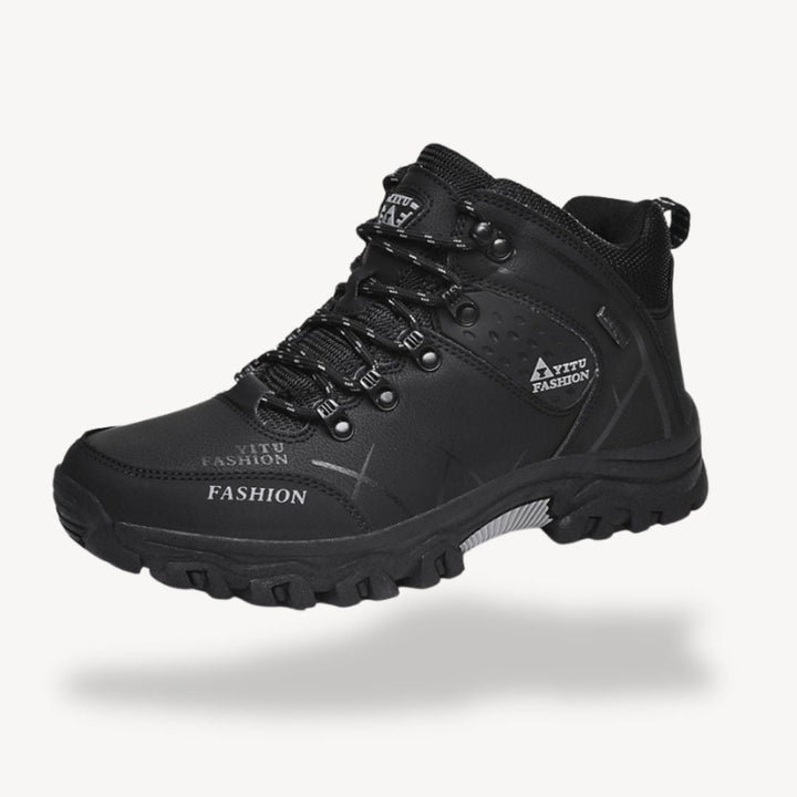 Men's waterproof orthopedic hiking boots with rugged outsole, showcasing durable design and secure lace-up closure.