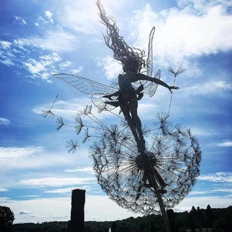 Metal fairy garden sculpture, weather-resistant, intricate design, black metal, adds whimsical charm to outdoor decor.