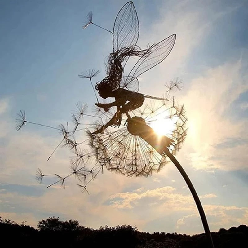 Metal fairy garden sculpture, weather-resistant, intricate design, black metal, adds whimsical charm to outdoor decor.