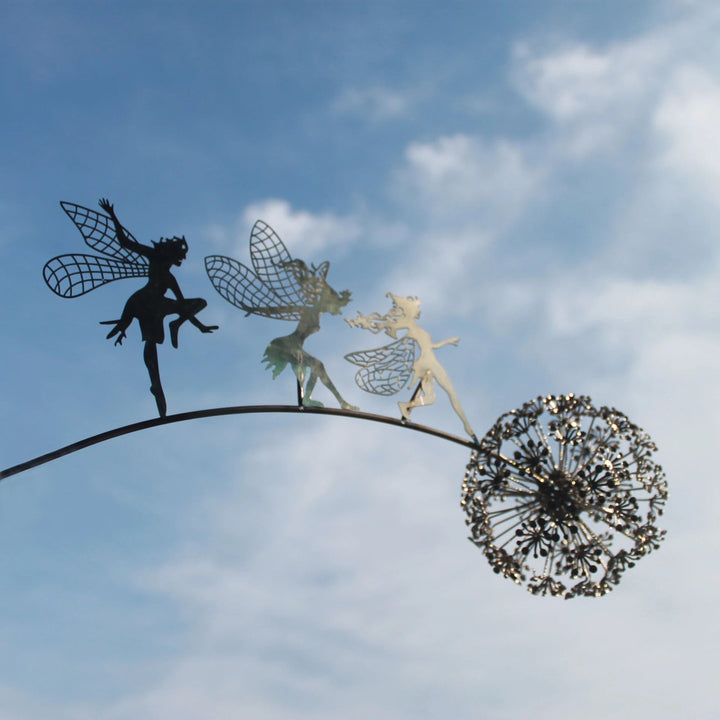 Metal fairy garden sculpture, weather-resistant, intricate design, black metal, adds whimsical charm to outdoor decor.