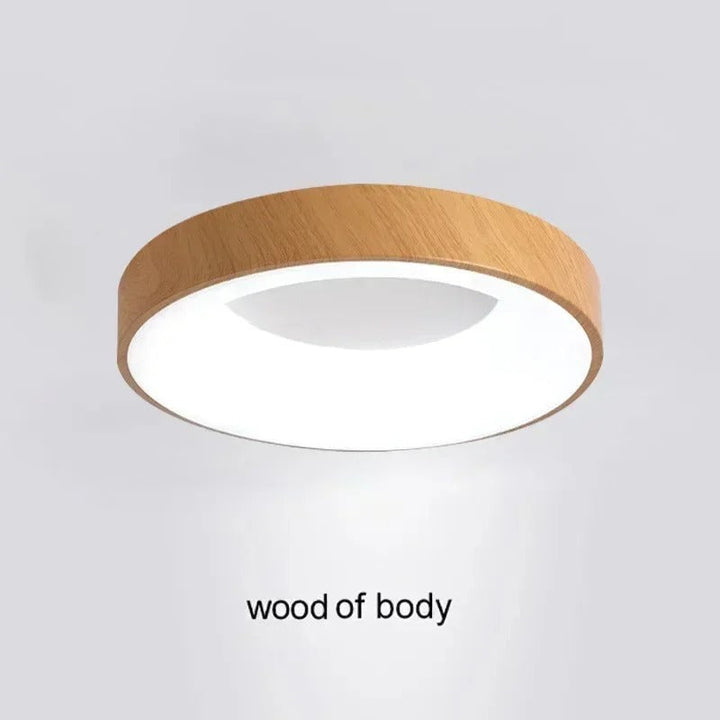 Modern circular LED ceiling light with sleek metal frame, soft ambient lighting; available in grey, white, wood finishes.