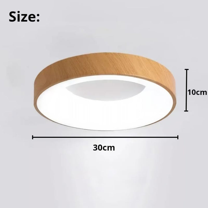 Modern circular LED ceiling light with sleek metal frame, soft ambient lighting; available in grey, white, wood finishes.