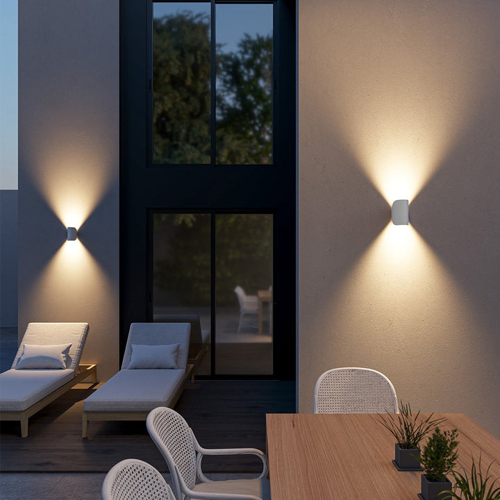 "Modern LED Up Down Wall Sconce Light, sleek black design, for indoor/outdoor use, illuminates spaces elegantly."