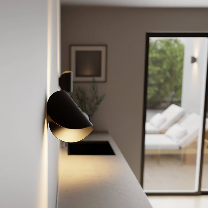 "Modern LED Up Down Wall Sconce Light, sleek black design, for indoor/outdoor use, illuminates spaces elegantly."