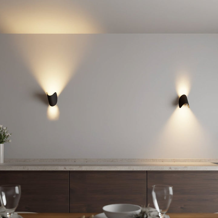 "Modern LED Up Down Wall Sconce Light, sleek black design, for indoor/outdoor use, illuminates spaces elegantly."