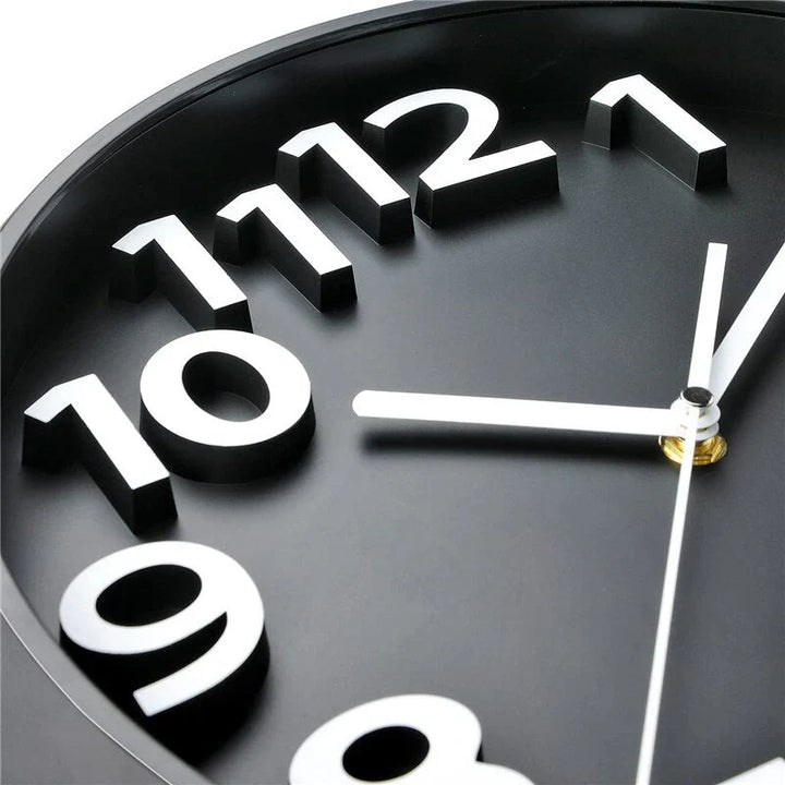 Modern minimalist wall clock with sleek black rim and silent operation, enhancing any room with its sophisticated design.