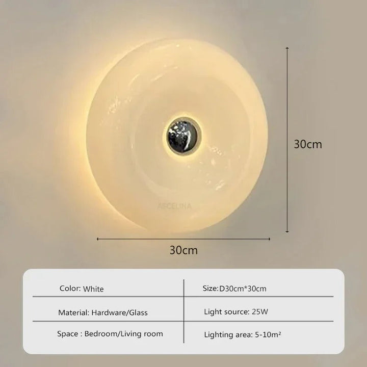 Orange donut-shaped LED lamp for table or wall, made of glass and metal, offering warm glow and whimsical décor touch.