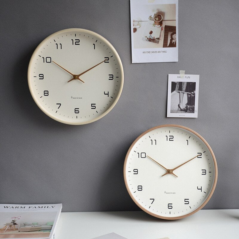 Scandinavian minimalist wooden wall clock with a simple circular design, cream and brown colors, fits modern home interiors.