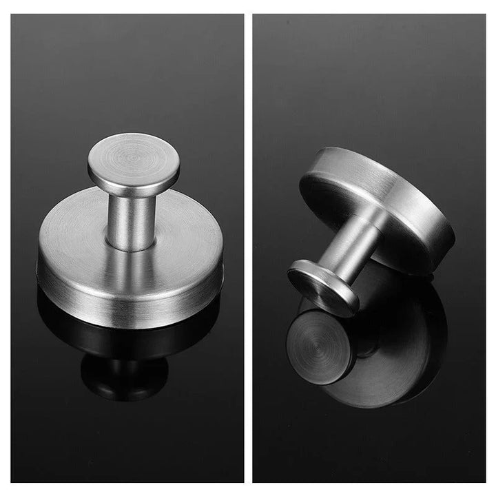 "Set of 4 sleek suction wall hooks for organized storage, perfect for bathrooms or kitchens. Supports up to 7 kg each."