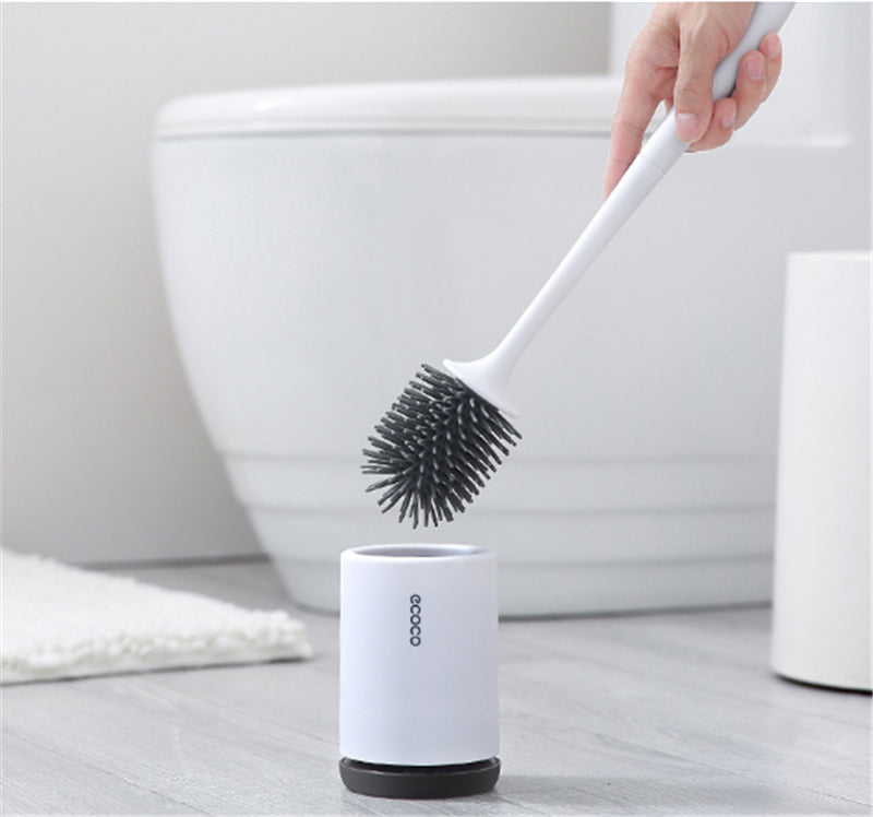 "Silicone toilet brush with non-scratch bristles, white wall-mounted design, keeps bathrooms pristine and surfaces undamaged.