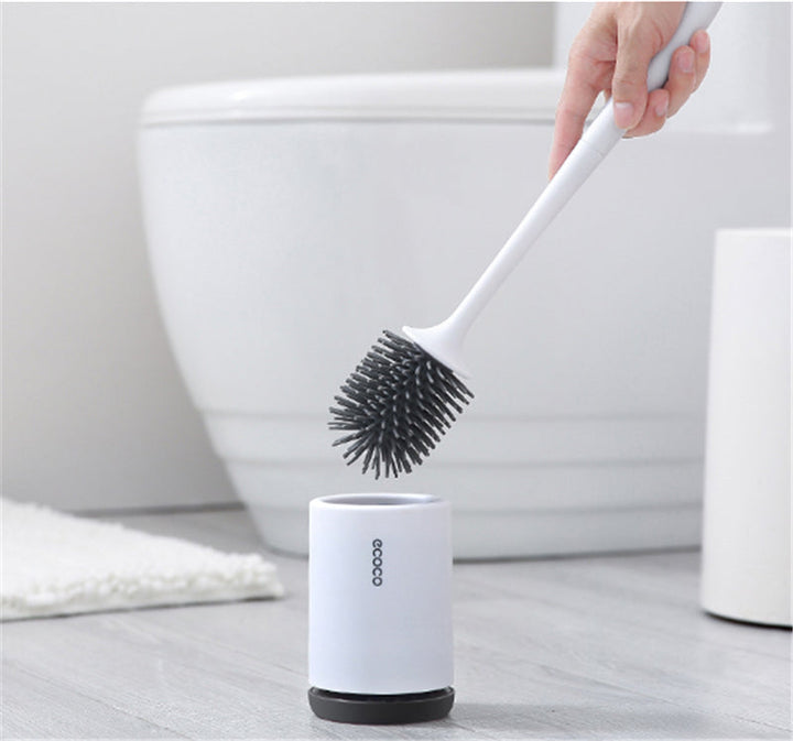 "Silicone toilet brush with non-scratch bristles, white wall-mounted design, keeps bathrooms pristine and surfaces undamaged.