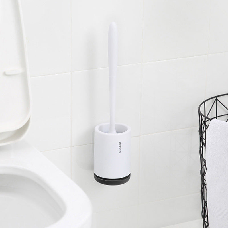 "Silicone toilet brush with non-scratch bristles, white wall-mounted design, keeps bathrooms pristine and surfaces undamaged.