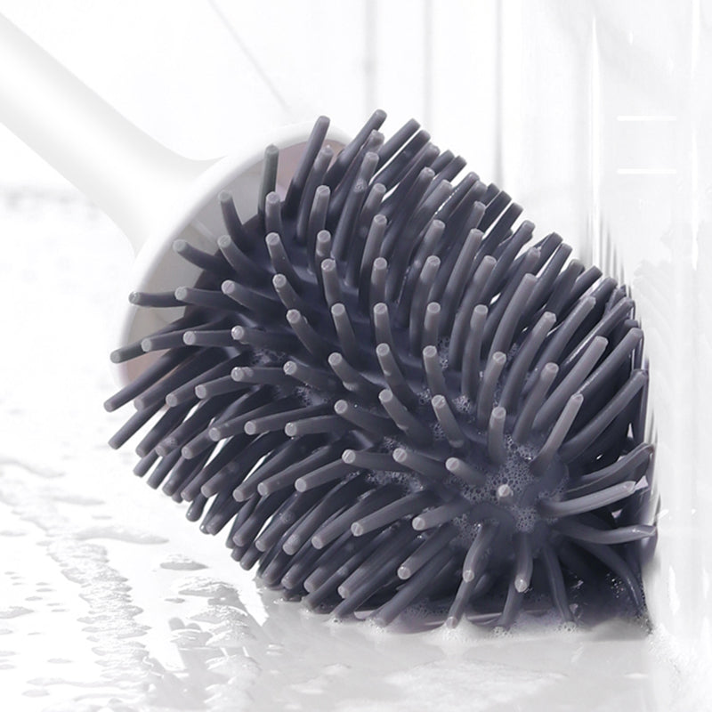 "Silicone toilet brush with non-scratch bristles, white wall-mounted design, keeps bathrooms pristine and surfaces undamaged.