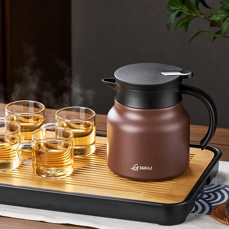 "Sleek insulated teapot with infuser, ceramic steel liners, 800ml capacity, in stylish brown, perfect for hot or cold drinks.