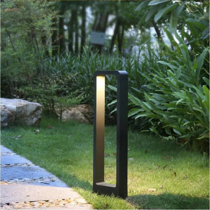 Sleek weatherproof garden bollard light, modern LED design in black and gray, perfect for outdoor pathways and patios.