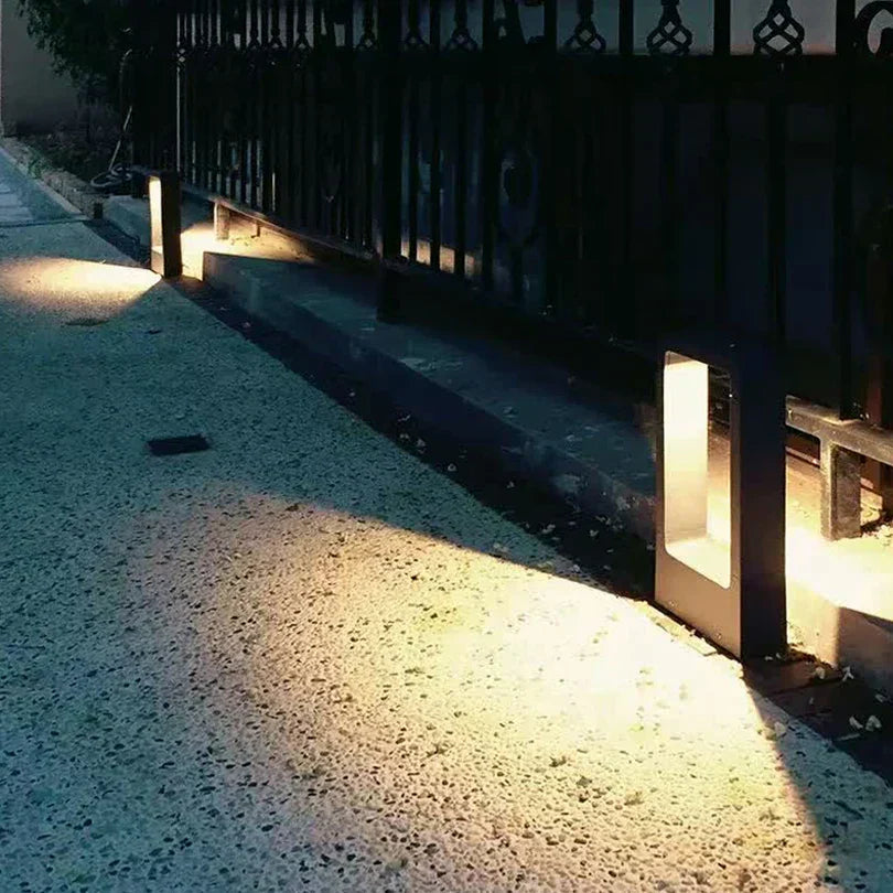 Sleek weatherproof garden bollard light, modern LED design in black and gray, perfect for outdoor pathways and patios.