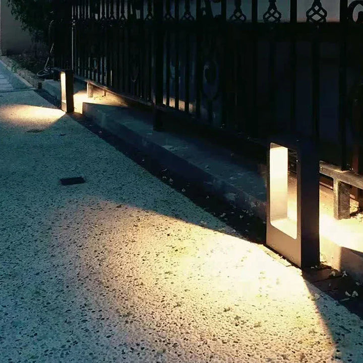 Sleek weatherproof garden bollard light, modern LED design in black and gray, perfect for outdoor pathways and patios.