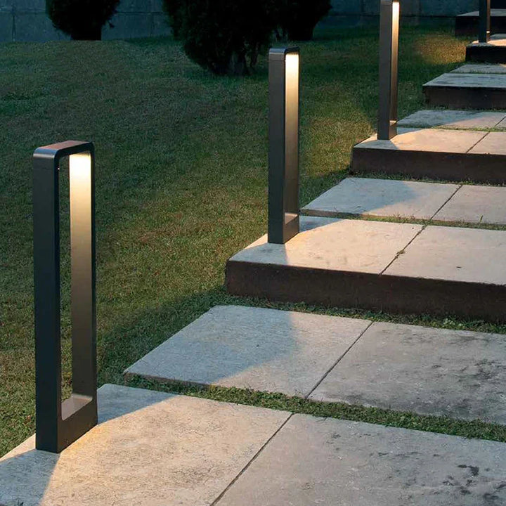 Sleek weatherproof garden bollard light, modern LED design in black and gray, perfect for outdoor pathways and patios.