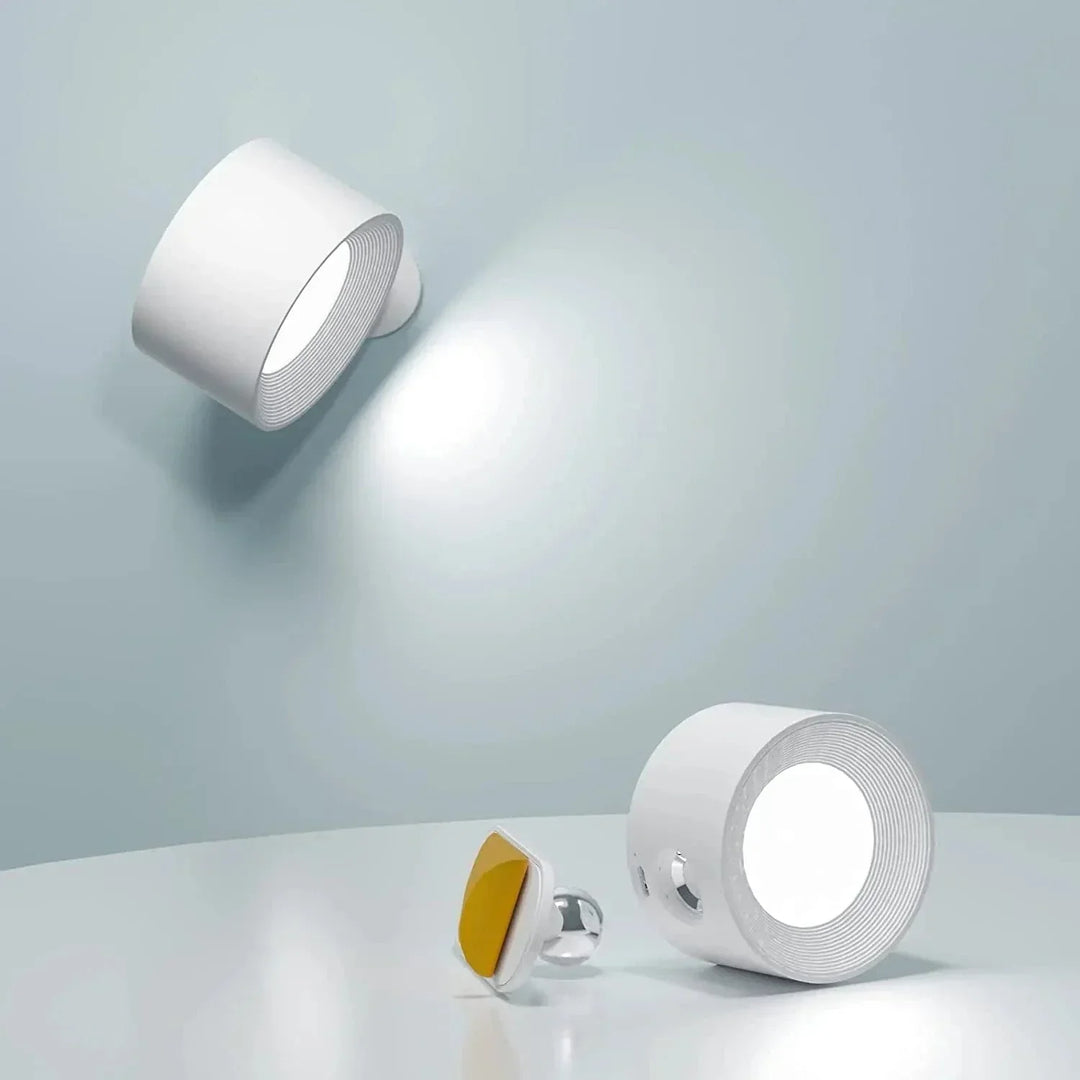 "Sleek wireless rechargeable wall light with magnetic mount and 360° rotation for modern home interiors."
