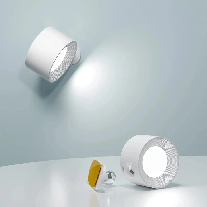 "Sleek wireless rechargeable wall light with magnetic mount and 360° rotation for modern home interiors."