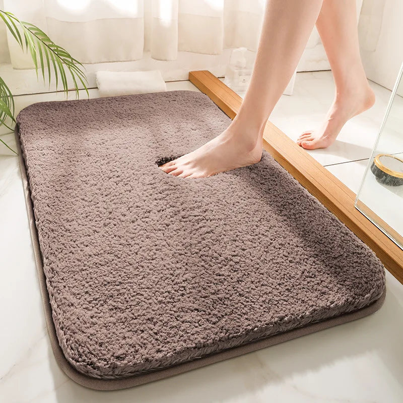 "Soft plush microfiber bathroom rug, beige, providing ultimate comfort with non-slip backing and excellent absorbency."