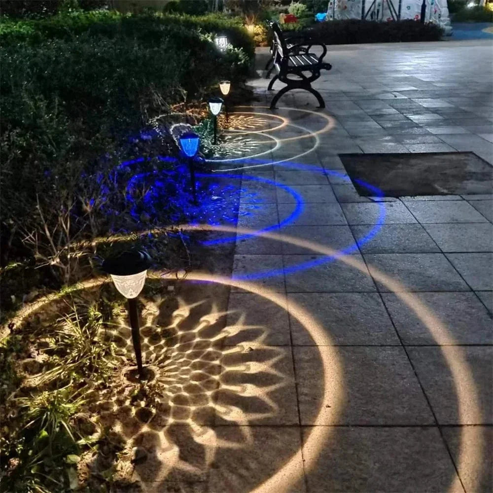 "Solar LED Mandala Garden Light casting intricate shadows on pathway, showcasing artistic outdoor illumination at night."