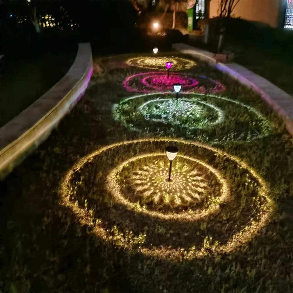 "Solar LED Mandala Garden Light casting intricate shadows on pathway, showcasing artistic outdoor illumination at night."