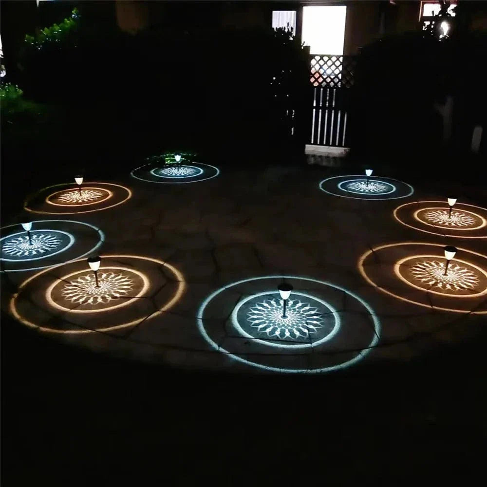 "Solar LED Mandala Garden Light casting intricate shadows on pathway, showcasing artistic outdoor illumination at night."
