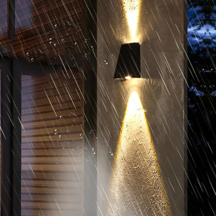 "Solar LED outdoor wall light illuminating up and down; eco-friendly, weather-resistant, elegant design; multiple light color