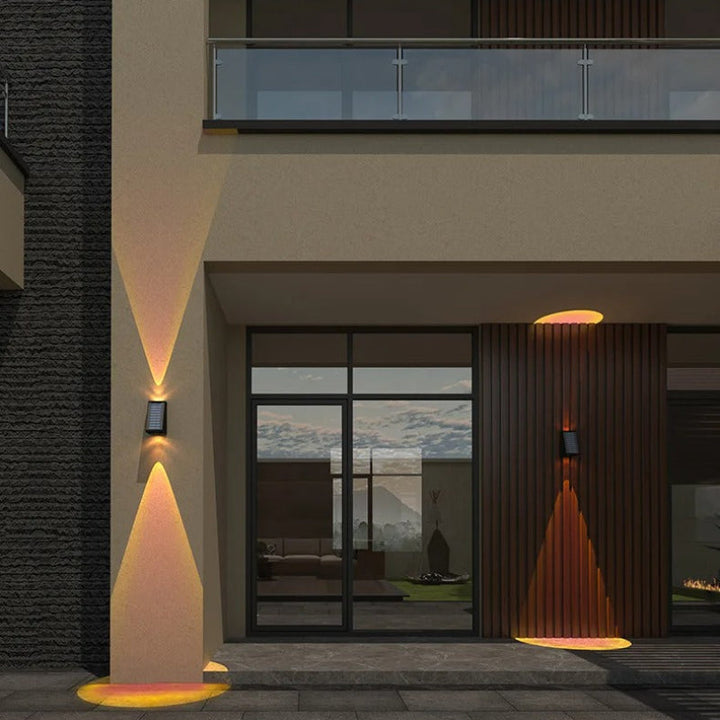 "Solar LED outdoor wall light illuminating up and down; eco-friendly, weather-resistant, elegant design; multiple light color