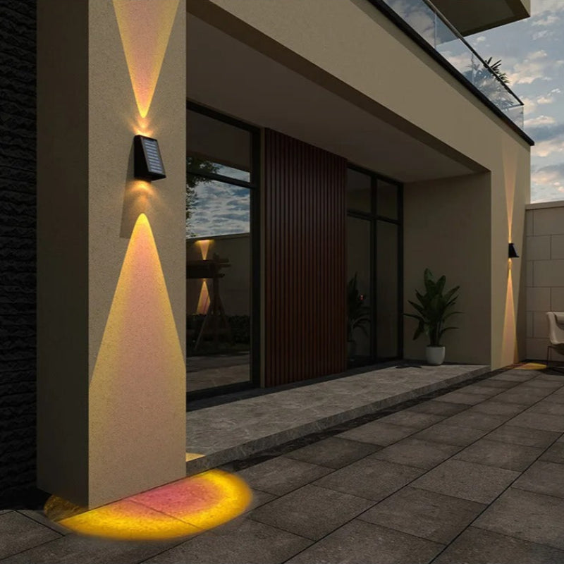 "Solar LED outdoor wall light illuminating up and down; eco-friendly, weather-resistant, elegant design; multiple light color