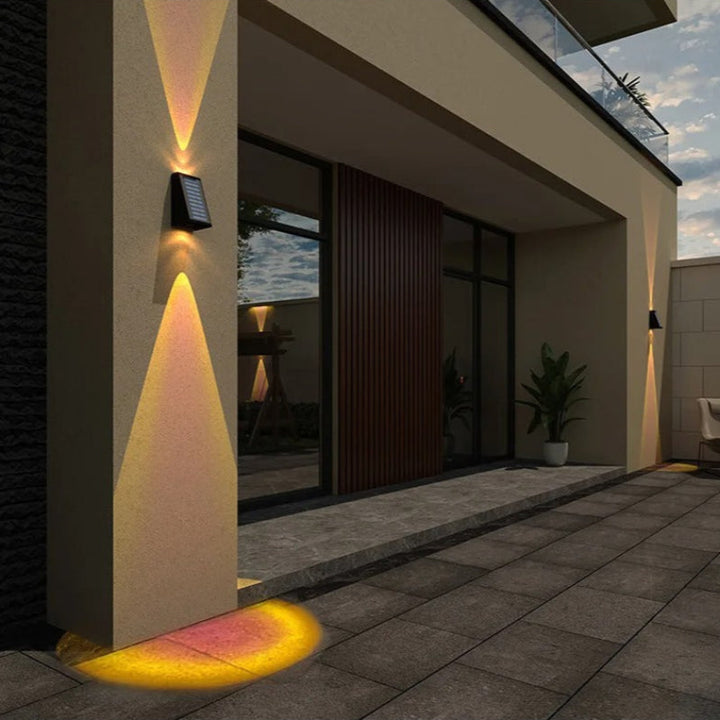 "Solar LED outdoor wall light illuminating up and down; eco-friendly, weather-resistant, elegant design; multiple light color