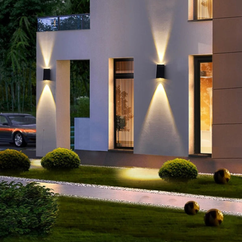 "Solar LED outdoor wall light illuminating up and down; eco-friendly, weather-resistant, elegant design; multiple light color