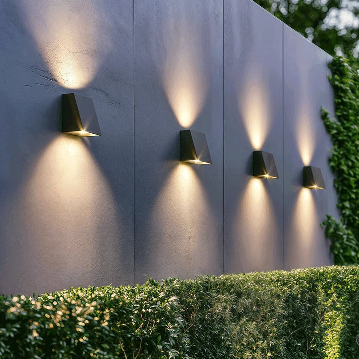 "Solar LED outdoor wall light illuminating up and down; eco-friendly, weather-resistant, elegant design; multiple light color