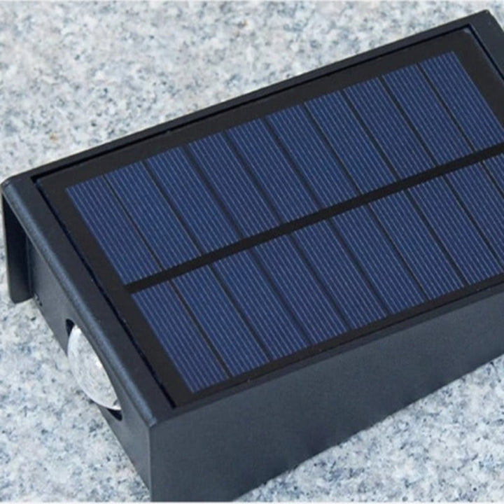 "Solar LED outdoor wall light illuminating up and down; eco-friendly, weather-resistant, elegant design; multiple light color