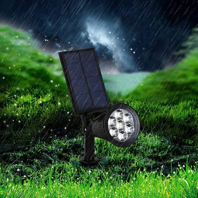 Solar-powered LED garden spotlight with sleek black design, adjustable head, and vibrant RGB lighting for outdoor use.
