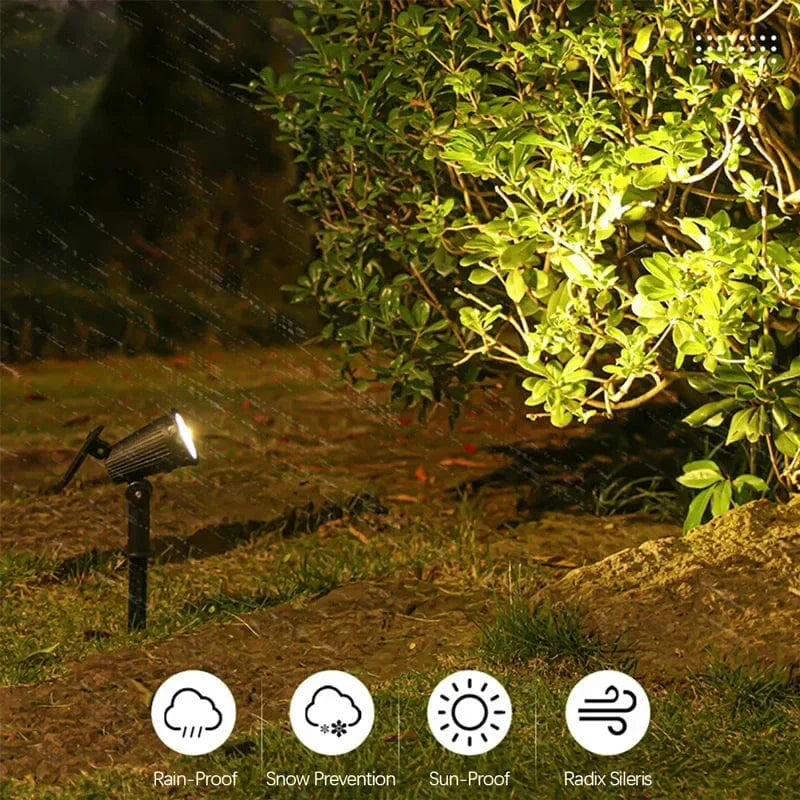 Solar-powered LED garden spotlight with sleek black design, adjustable head, and vibrant RGB lighting for outdoor use.