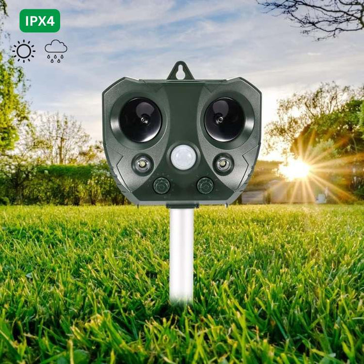 "Solar-powered ultrasonic bird and pest repeller, waterproof, with motion sensor and LED lights for garden use."