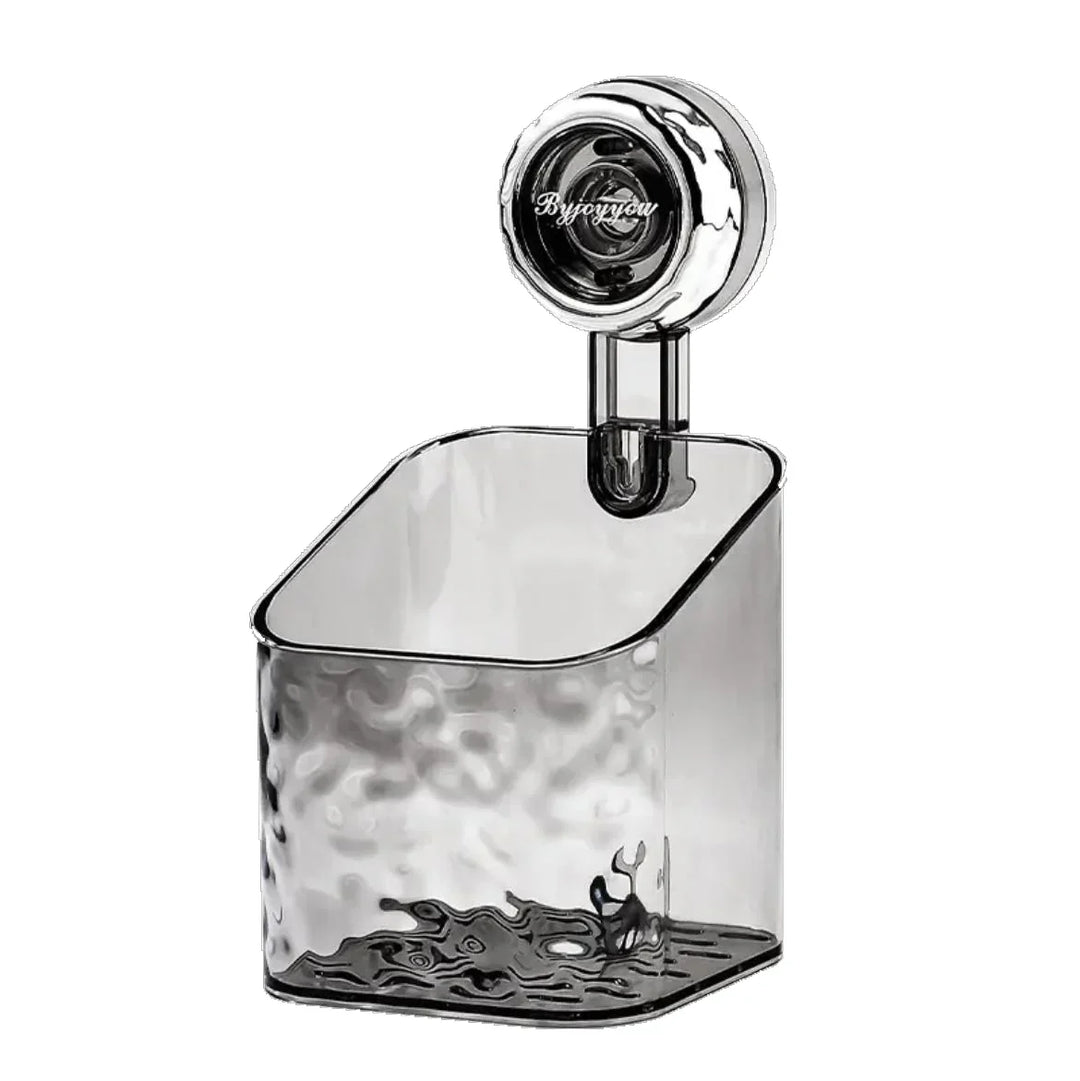 "Transparent no-drill bathroom caddy with strong suction cups, mounted on wall, for organizing toiletries and kitchen tools."