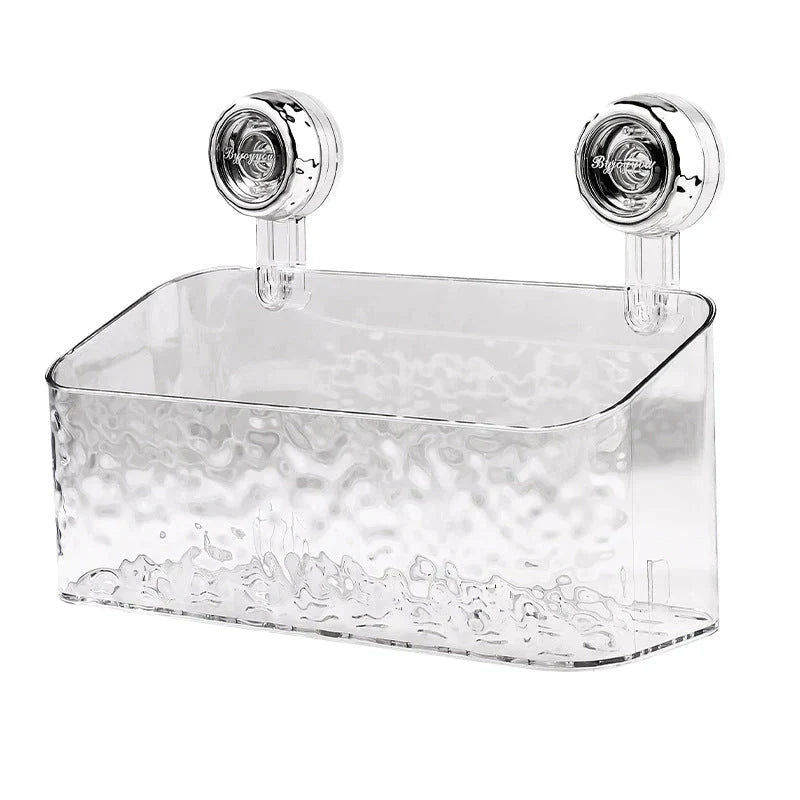 "Transparent no-drill bathroom caddy with strong suction cups, mounted on wall, for organizing toiletries and kitchen tools."