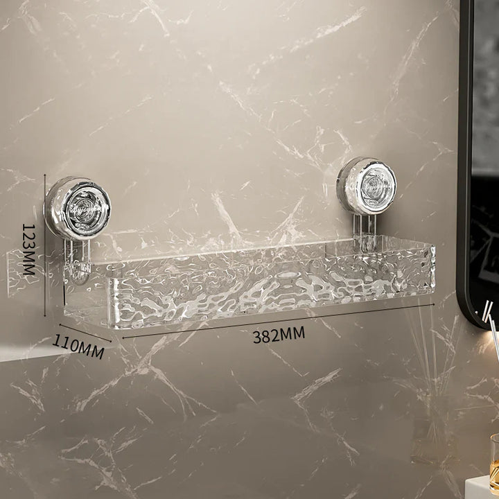 "Transparent no-drill bathroom caddy with strong suction cups, mounted on wall, for organizing toiletries and kitchen tools."
