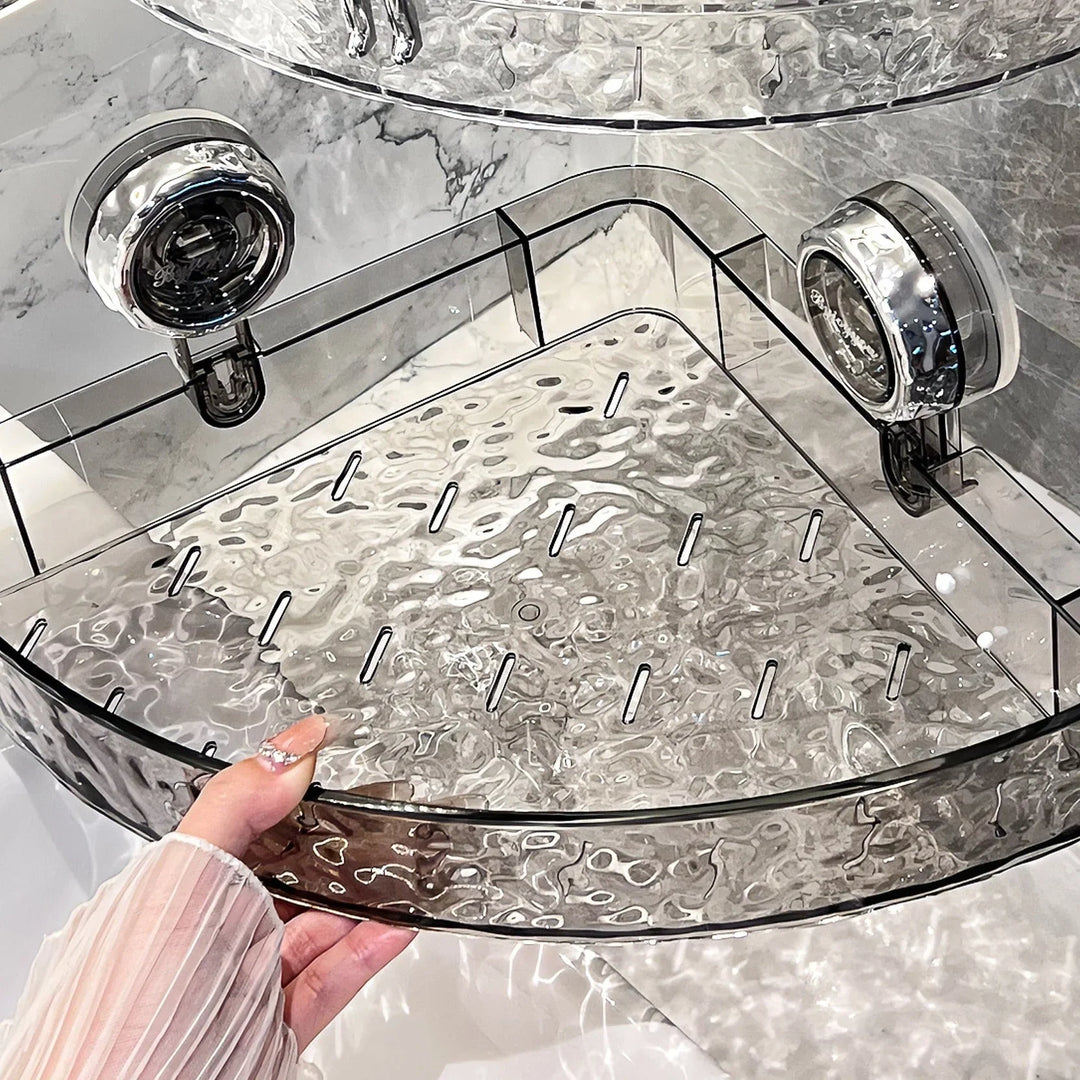 "Transparent no-drill bathroom caddy with strong suction cups, mounted on wall, for organizing toiletries and kitchen tools."