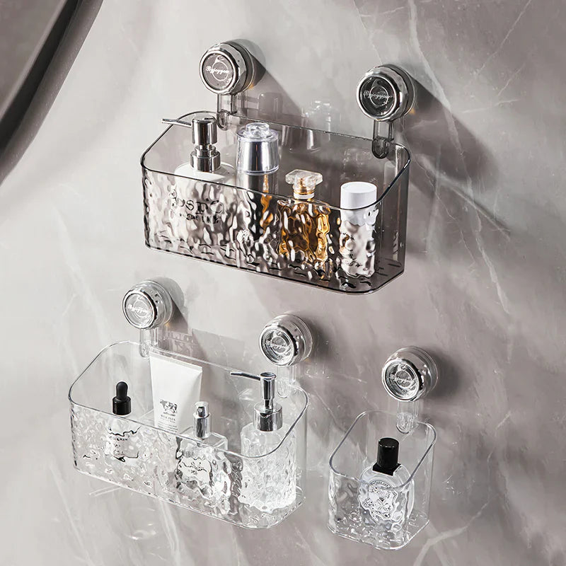 "Transparent no-drill bathroom caddy with strong suction cups, mounted on wall, for organizing toiletries and kitchen tools."