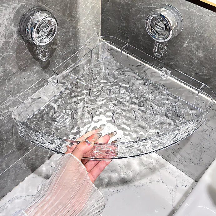 "Transparent no-drill bathroom caddy with strong suction cups, mounted on wall, for organizing toiletries and kitchen tools."