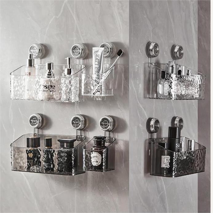 "Transparent no-drill bathroom caddy with strong suction cups, mounted on wall, for organizing toiletries and kitchen tools."